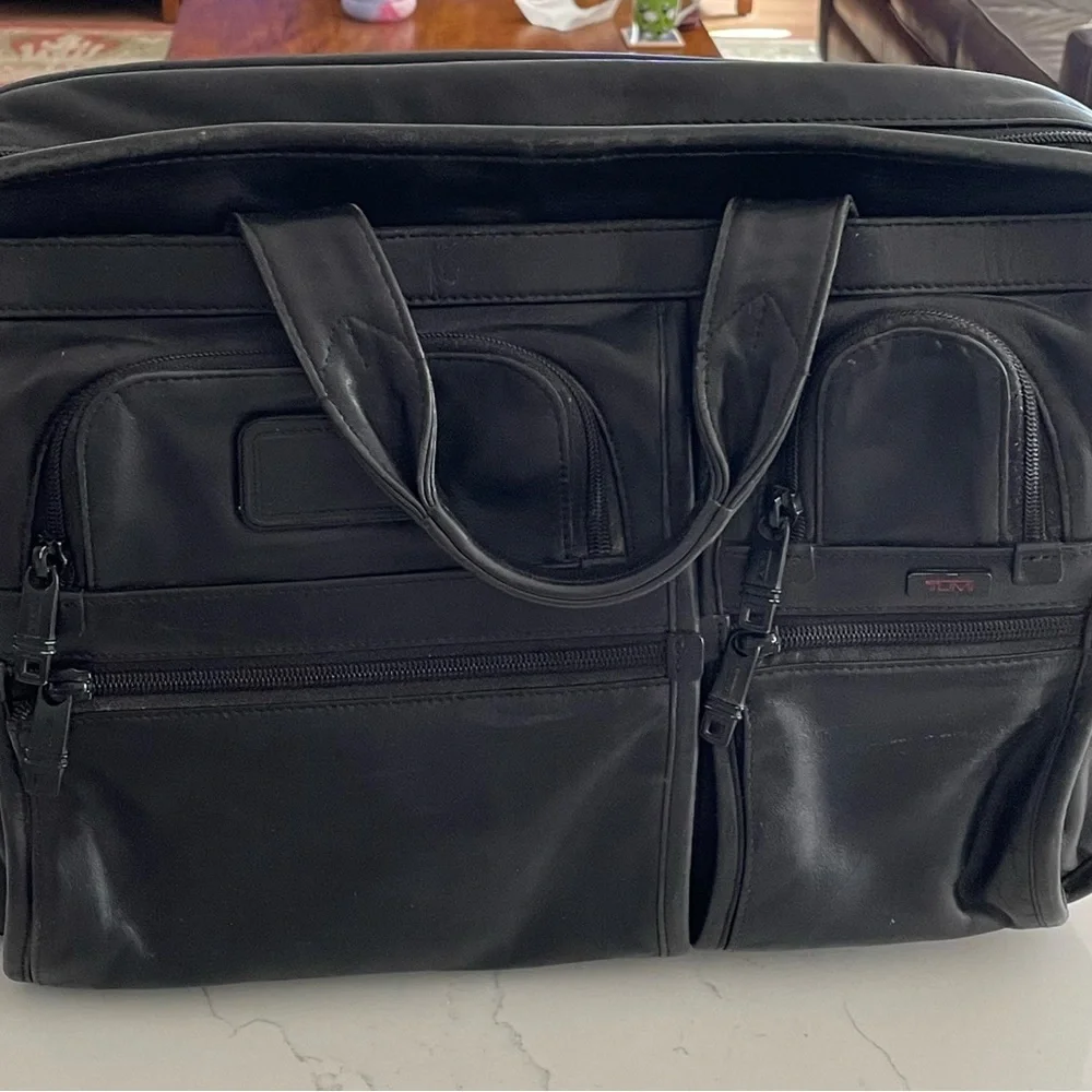 Tumi leather T pass medium laptop bag.Briefcase bag.Lots of pockets .